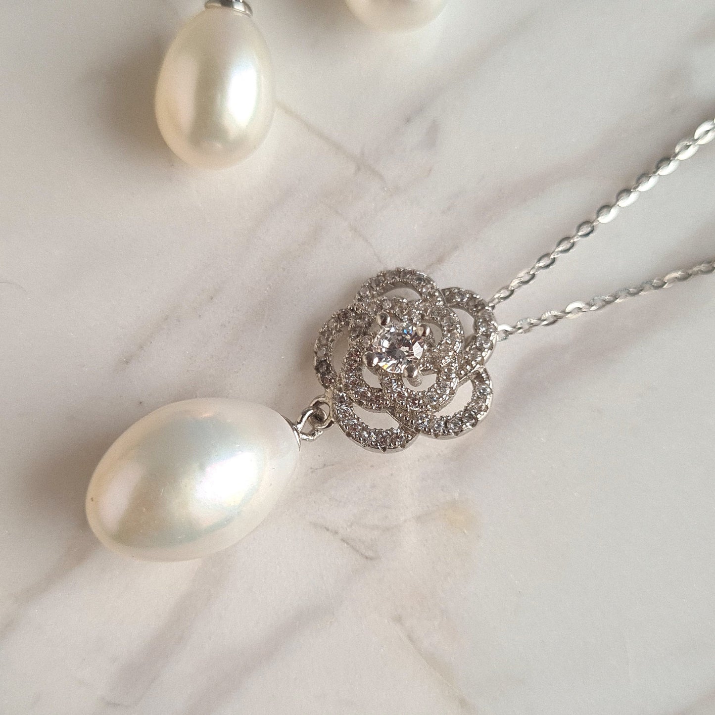 AAA Quality Oval Fresh Water Pearl with Rose design Sterling Silver Stud with Cubic Zirconia Crystal Earrings